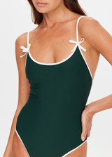 THE UPSIDE women's green recycled soft peached Racquet Flow Bodysuit is fully lined and features a scoop neckline, adjustable straps and a cream bow detail at chest. Made for tennis, gold & pickleball.