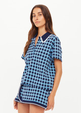 THE UPSIDE women's navy and blue plaid cotton Clubhouse Dom Polo Shirt is a relaxed fit and features a knitted collar with cream crochet detailing on edge. Made for tennis, golf & pickleball.