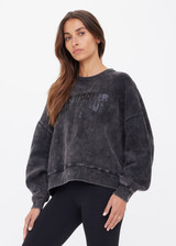 THE UPSIDE women's washed black Cosmic Paloma Crew is an oversized fit with a drop shoulder crafted from heavy organic cotton brushed fleece. Made for everyday.