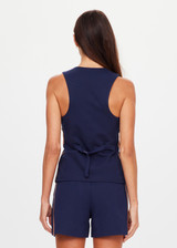 THE UPSIDE women's navy Toledo Greer Vest Top features tan knitted tape down sides, an adjustable waistbelt with buckle and tortoiseshell buttons. Made for lifestyle.