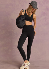 THE UPSIDE women's black recycled jacquard Castilla 25inch Legging is high-rise with a V panel waistband. Made for yoga & pilates.