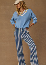THE UPSIDE women's blue organic cotton Rever Josette V Neck Sweater is designed for a relaxed fit and features a striped V neckline in yellow and blue and contrast starts on sleeves. Made for everyday.
