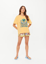 THE UPSIDE women's yellow organic cotton Paradise Jacob Tee is designed for an oversized fit and features a printed Paradise graphic on front. Made for everyday.