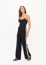 THE UPSIDE women's black Freya Knit Pant has a straight leg fit and features an elasticated waistband  and short splits at hem. Made for lifestyle.
