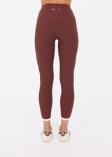 THE UPSIDE women's brown recycled rib Rhythm 25inch Legging has a mid-rise fit and features cream and yellow binds along side seams. Made for yoga & pilates.
