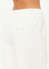 THE UPSIDE women's cream organic cotton terry Arkana Estelle Pant is designed for a relaxed fit with a barrel shaped leg and features an elasticated waistband and side pockets. Made for lifestyle.