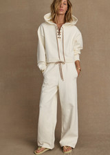 THE UPSIDE women's cream organic cotton terry Arkana Estelle Pant is designed for a relaxed fit with a barrel shaped leg and features an elasticated waistband and side pockets. Made for lifestyle.