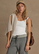 THE UPSIDE women's cream organic cotton Del Rey Pointelle Tank Top features a scooped lace trim neckline with a soft ribbed fabrication. Made for everyday wear.