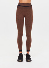 THE UPSIDE women's brown seamless Marle Seamless 25Inch Midi Legging offers a mid-rise with a black stripe at waistband. Made for yoga & pilates.