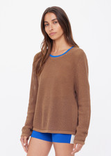 THE UPSIDE women's brown organic cotton Avalon Bayli Knit Crew is a crew neck sweater with drop shoulders in brown, a ribbed neckline in contrast blue and open knit construction. Made for lifestyle.