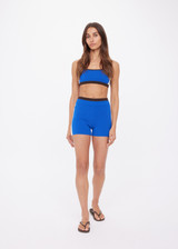 THE UPSIDE women's blue Montage Speechless Short offers a knitted design with a mid-rise, a soft brown waistband, and cream side pannels. Made for yoga & pilates.