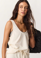 THE UPSIDE women's cream cotton Noosa Calling Tank Top is a relaxed fit in a soft brushed recycled fabrication, featuring a scoop neckline and inside bind edges. Made for lifestyle.