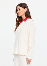 THE UPSIDE women's cream cotton Noosa Calling Collared Top is a relaxed long sleeve top in a soft brushed recycled fabrication with contrast red at the neck. Made for lifestyle.