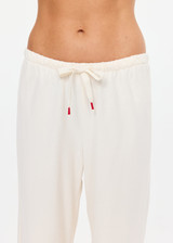 THE UPSIDE women's cream cotton Noosa Calling Track Pant is a low-rise straight leg pant with a soft elastic waistband, made from soft brushed recycled fabric. Made for lifestyle.