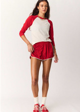 THE UPSIDE women's cream 100% organic cotton Take Me To The Ball Park Top features a soft ribbed neckline with contrast red 3/4 length sleeves. Made for lifestyle.