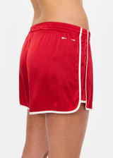 THE UPSIDE women's red 100% silk Run For Your Life Silk Short is a low-rise fit with a soft elastic waistband and cream piping along side seams. Made for lifestyle.
