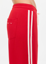 THE UPSIDE women's red When In Roma Holiday Pant is high waisted with an elasticated waistband, made from double faced single jersey fabrication with cream mesh tape along side seams. Made for lifestyle.