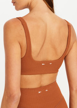 THE UPSIDE women’s brown recycled jacquard Mariana Bridie Sports Bra is designed for a soft, supportive fit and features removable cups and textured fabrication. Made for yoga and pilates.