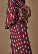 THE UPSIDE women’s stripe 100% silk Capela Charli Drawstring Pant is a low rise straight leg pant and features a soft elastic waistband, side hem splits and drawcord detail. Made for lifestyle.