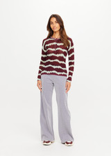 THE UPSIDE women’s tie dye 100% linen Rio Eli Long Sleeve Knit is a regular fit crew neck top and features a lightweight knit fabrication, button front opening and ribbed neckline. Made for lifestyle.