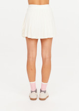 THE UPSIDE women’s cream recycled Cadiz Pleated Skirt is designed for a true to size fit and features a pleated design, built in inner short with pockets and drawcord detail. Made for tennis.