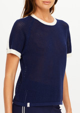 THE UPSIDE women’s navy 100% organic cotton Fenway Jordan Knit Tee offers a relaxed fit and features an open knit construction, contrast sleeve stripe detailing and ribbed trims. Made for lifestyle.