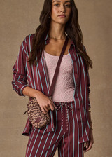 THE UPSIDE women’s stripe 100% silk Capela Billy Silk Shirt is a relaxed fit long sleeve button up and features a collar, button cuffs and stripe satin finish. Made for lifestyle.