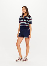 THE UPSIDE women’s navy recycled polyester Cleopatra Short features a mid rise elasticated waistband, curved hem with side splits, back pockets and contrast stripe tape detail. Made for lifestyle.
