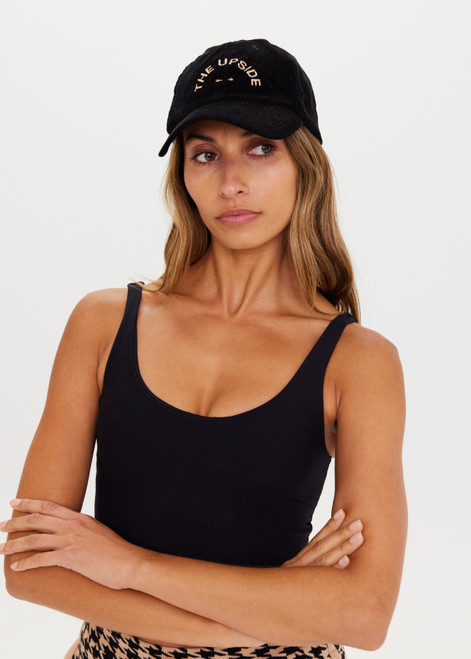 THE UPSIDE Corduroy Soft Cap in Black is a soft retro fit cap with embroidered preppy logo at front and adjustable velcro strap in a soft corduroy classic black.