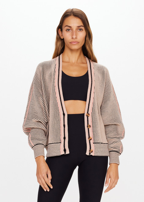 THE UPSIDE Nirvana Jessi Crop Cardigan in Natural is a sustainable organic cotton oversized cropped knitted cardigan with a button front and two tone ribbed knit construction.