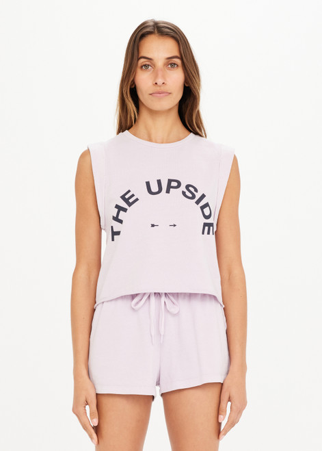 THE UPSIDE Akasha Cropped Muscle in Orchid Purple is a sustainable organic cotton relaxed fit, sleeveless cropped muscle tank printed with our horseshoe logo at centre front.