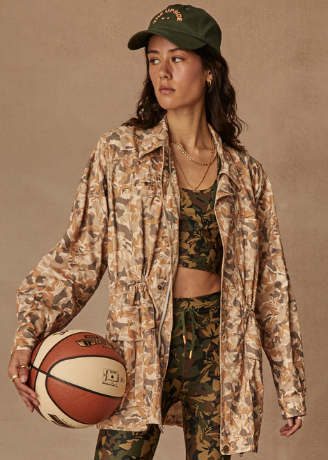 THE UPSIDE Henley Rover Utility Jacket in our Desert Camo print is a sustainable organic cotton utility jacket with pockets, zipper and press stud placket closure, internal cotton drawcord at waist and shoulder panel detailing.