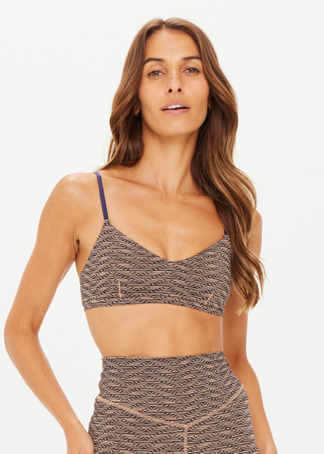 THE UPSIDE women's metallic Libertine Ballet Bra features a navy base and gold zig-zag design. It is a low coverage bra with soft support featuring elasticated and adjustable straps.