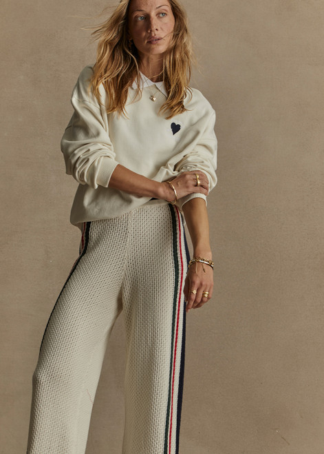 THE UPSIDE women's creme Pascal Collared Crew is made with organic french terry, designed for a relaxed fit. This classic crew features a built-in ribbed collar. A lifestyle essential.