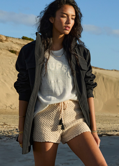 THE UPSIDE women's natural Luminary Crochet Hali Short is made from cotton. The side stripe short features drawstring at waist. Designed for travel and holiday.