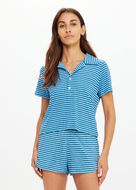 THE UPSIDE women's blue stripe Rio Lilou Polo top features a soft stretch terry fabrication with cropped polo shape and button front. The perfect vacation piece.