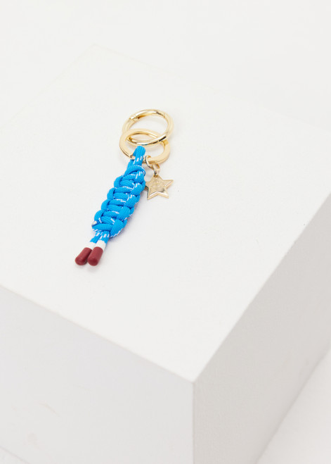 THE UPSIDE women's blue Limitless Keyring charm with gold metal star and macrame paracord in bright blue with rubber dipped ends.