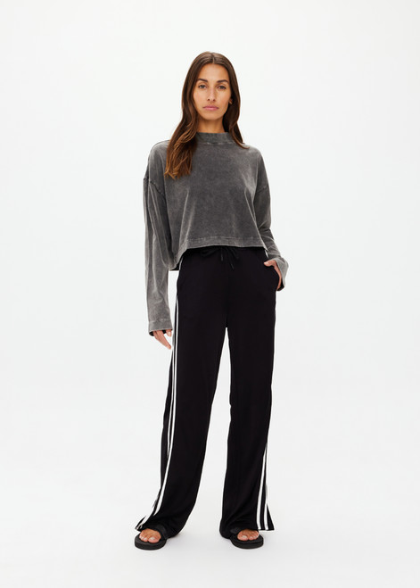 THE UPSIDE women's black Roma Pant is high-waisted with a elasticated waistband with drawcord, contrast cream stripes down sides and front & back pockets. The perfect everyday pant.