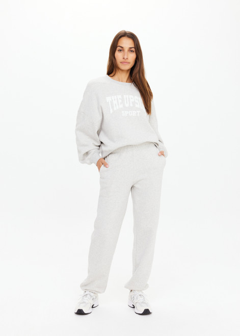 THE UPSIDE women's grey Harrison Track Pant is a mid to low rise fit and features a slim elasticated waistband, side pockets and an embroidered arrow logo on back. Perfect for travelling or everyday.