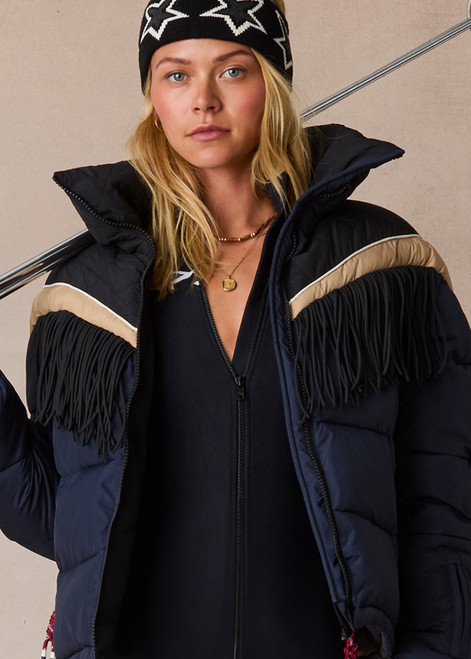 THE UPSIDE women's navy Hakuba Fox Puffer Jacket is a true-to-size fit, featuring a water-resistant coating, fringed detailing, fleece-lined zip pockets and an adjustable elastic at hem. Designed for Après-ski and winter wear.
