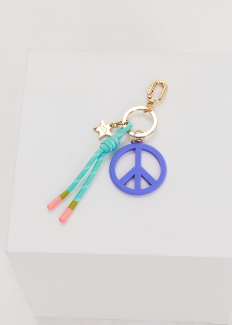 THE UPSIDE blue Peace Keyring features a gold metal star and knotted paracord in minty blue and white, finished with rubber dipped ends.