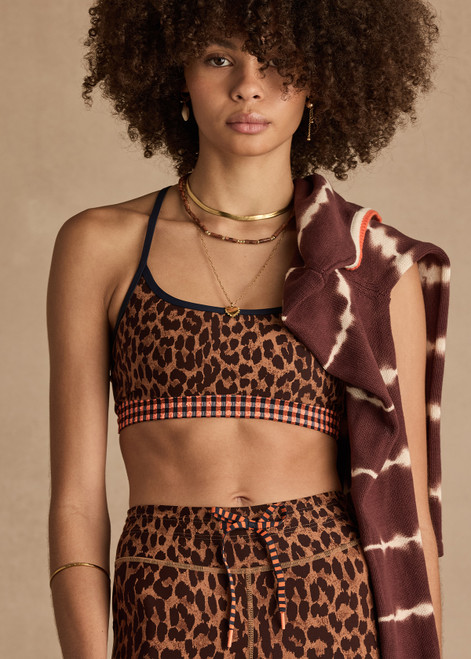 THE UPSIDE women's leopard Malawi Badu Crossback Bra offers soft & supportive fit with a scooped front neckline, crossback straps and removable cups. Made for yoga & pilates.
