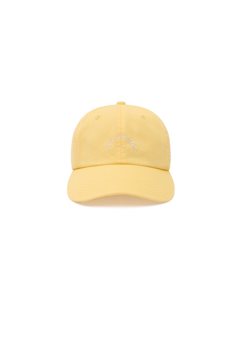 THE UPSIDE women's yellow Paradise Soft Cap features an adjustable strap and an embroidered horseshoe logo at front in cream. Made for everyday.