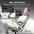 Person reclining in an ergonomic office chair with a 136-degree tilt, adjustable headrest, lumbar support, and armrests, demonstrating the chair's full recline function.