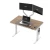 Ripple standing desk in Warm Oak with white frame and dual monitor workstation setup