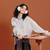 TopJob AnyDesk Fold portable standing desk in Coral with user and desktop controls