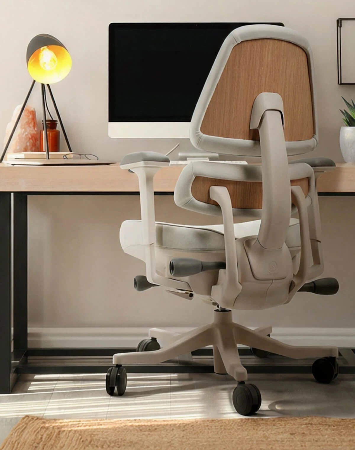 Light-frame Anthros ergonomic office chair with wood-grain back panels at a home-office desk
