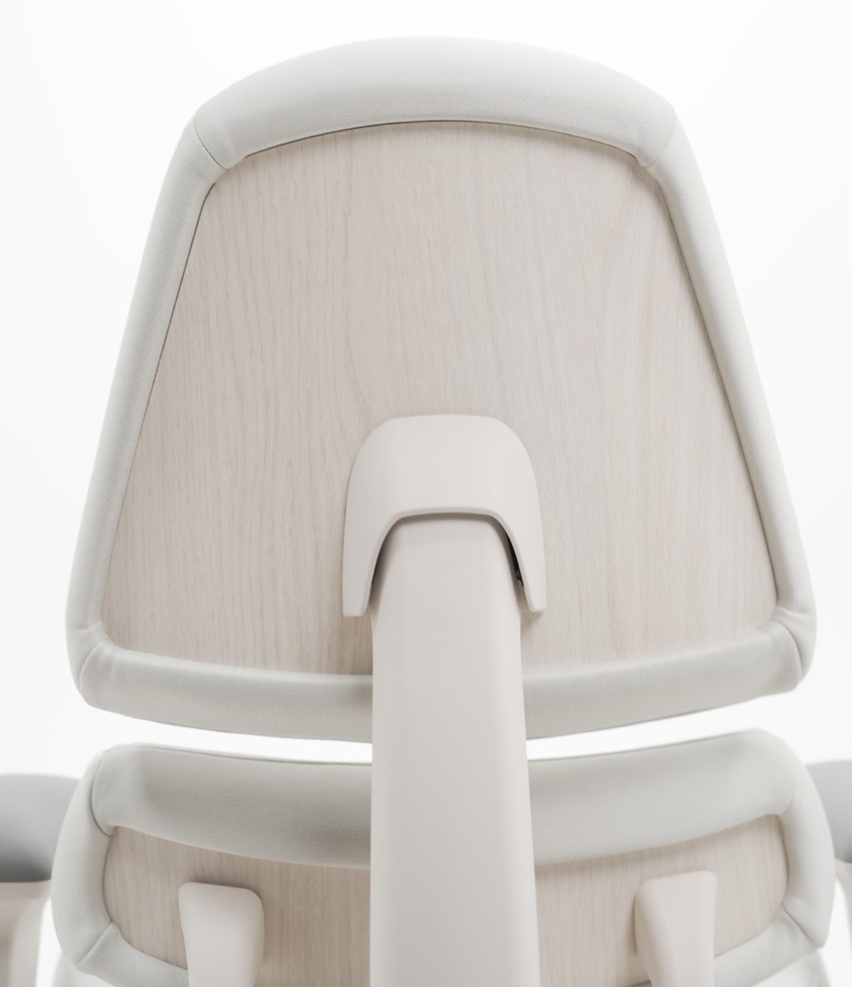 Close-up of Anthros light wood-grain upper and lower back panels with light upholstery and frame