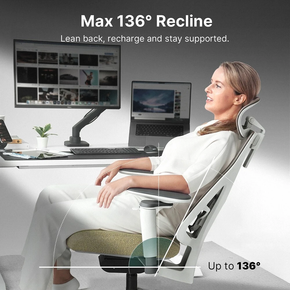 Person reclining in a gray Hinomi D3 chair with adjustable headrest