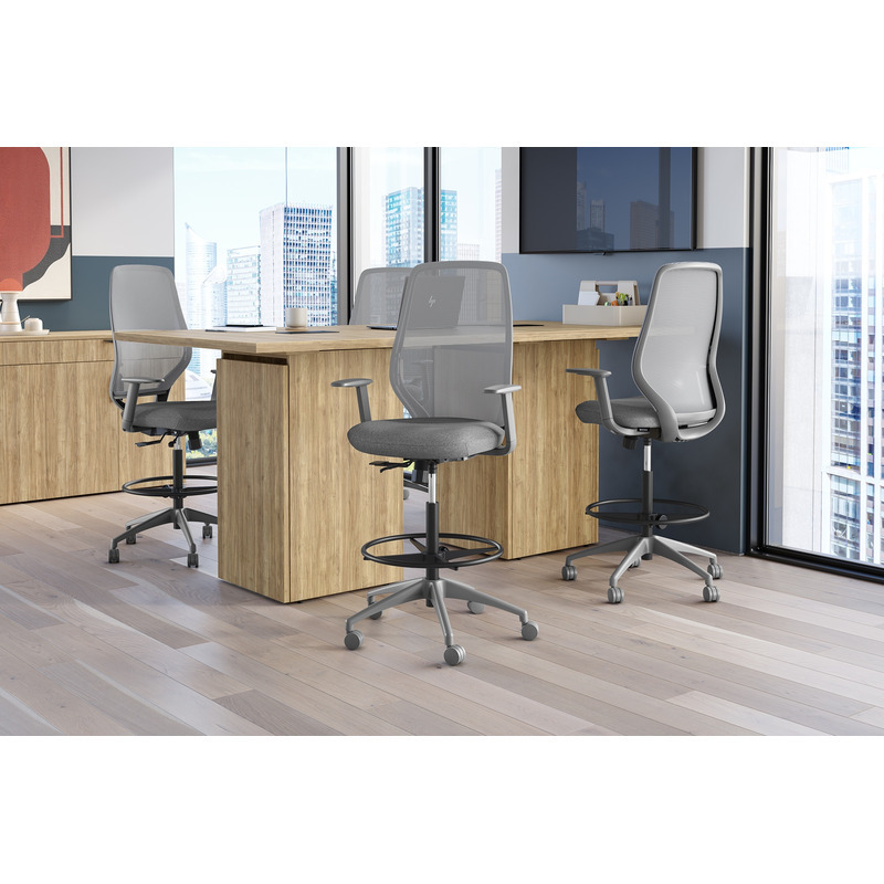 Gray Konfurb AX mesh back drafting chairs with foot rings at an elevated office worktable